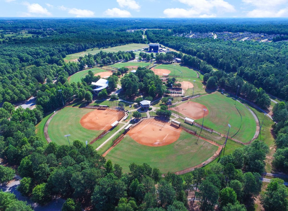 Aerial view of the ballfields at Heritage Park surrounded by trees