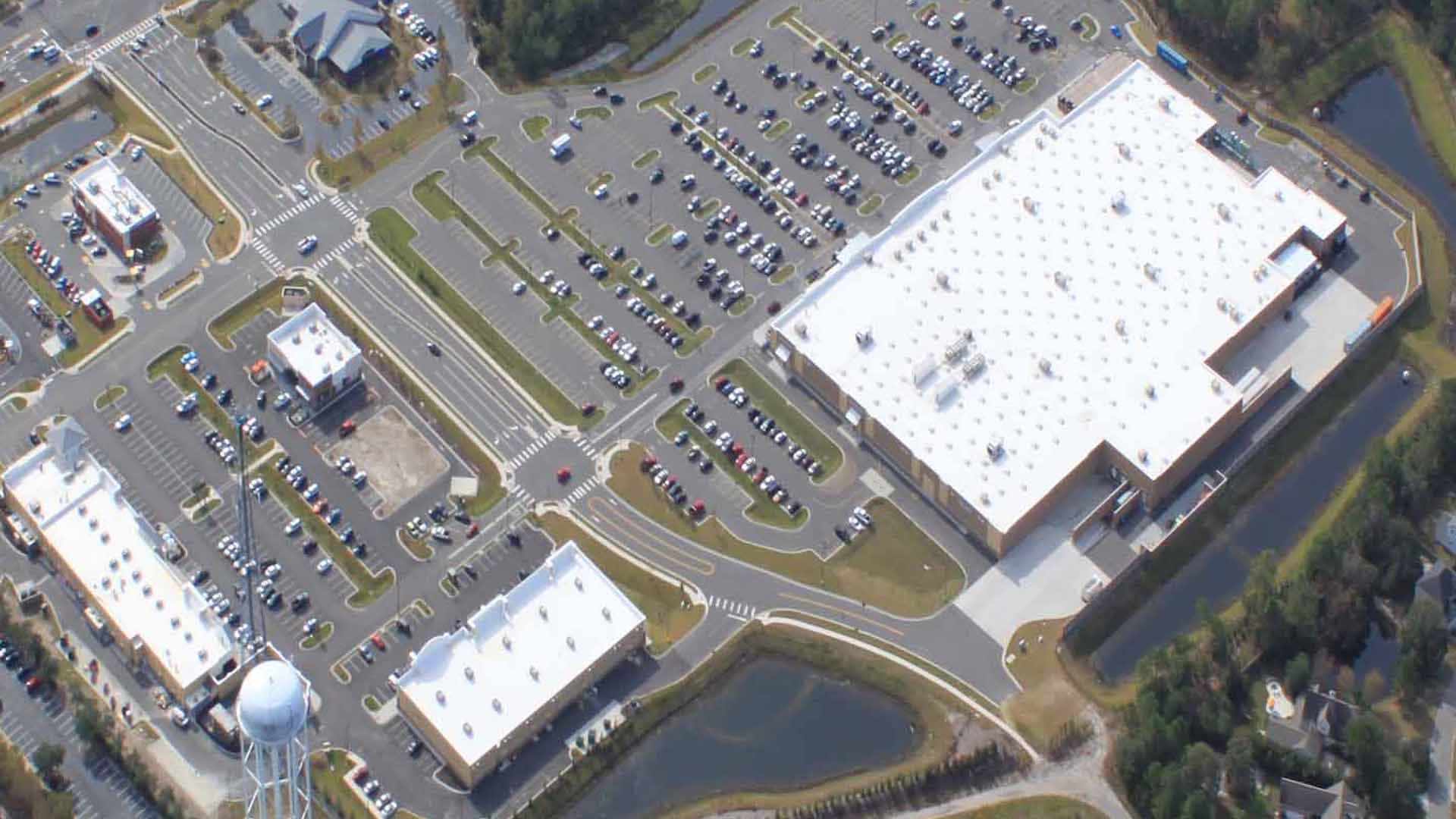 Aerial view of a Walmart shopping plaza and parking field